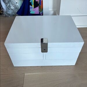 White jewelry box with mirror and four different drawers